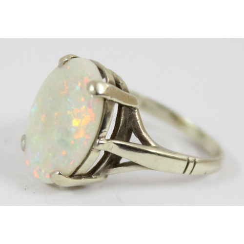 1148 - A 9ct gold and opal set ring, marks rubbed but XRF confirmed as 9ct gold, approx size N, approx 3.32... 