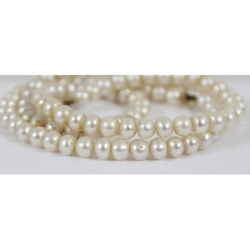 1159 - A 9t gold mounted pearl necklace, approx 41cm long, the clasp unmarked but XRF tested and a silver m... 