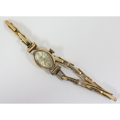 1307 - A 9ct gold cased ladies Rotary watch on rolled gold strap, case marked for London 1961, approx 9.83g... 