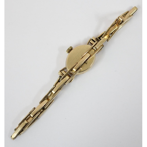 1307 - A 9ct gold cased ladies Rotary watch on rolled gold strap, case marked for London 1961, approx 9.83g... 