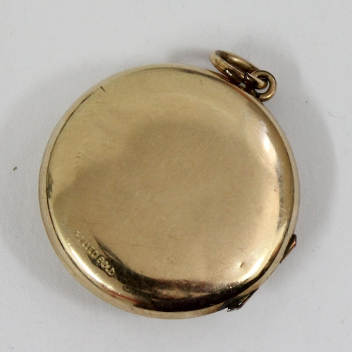 1433 - An early 20th century rolled gold sweetheart locket with enamel RAF crest, approx 27mm in diameter