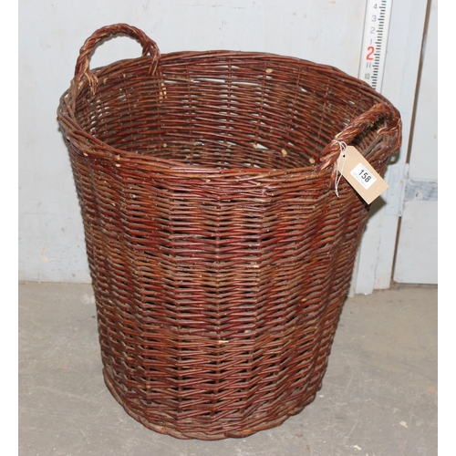 158 - A large wicker log basket, approx 70cm tall, approx 63cm in diameter