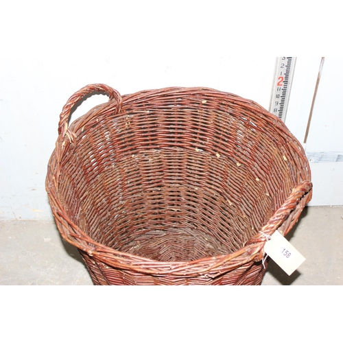 158 - A large wicker log basket, approx 70cm tall, approx 63cm in diameter