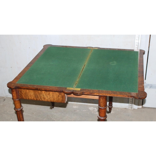 161 - A 19th century burr walnut card table with baize lined interior, concertina mechanism, unnamed but o... 