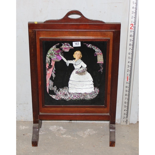 163 - An Art Deco period wooden framed fire screen with foil backed glass panel depicting a crinoline lady... 