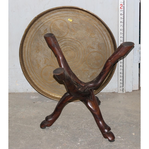 164 - A copper tray topped table with folding wooden base, the top approx 64cm in diameter