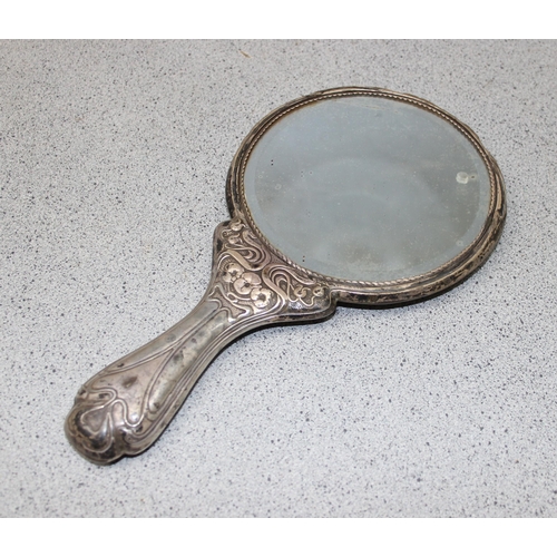 1003 - A silver mounted hand mirror, 2 silver mounted Art Nouveau brushes and a silver mounted comb, Birmin... 