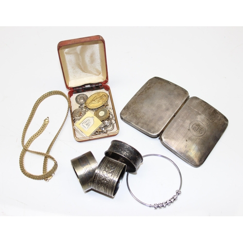 1013 - Silver cigarette case and a silver napkin ring, gross weight approx 94.96g, 2 silver plated napkin r... 