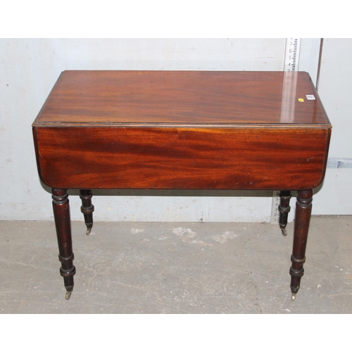 126 - Antique mahogany Pembroke table with brass casters