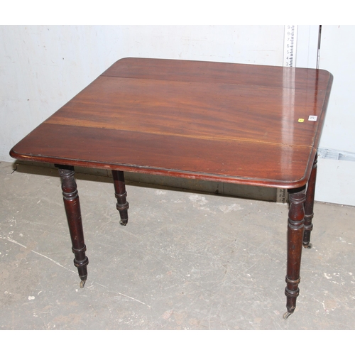 126 - Antique mahogany Pembroke table with brass casters