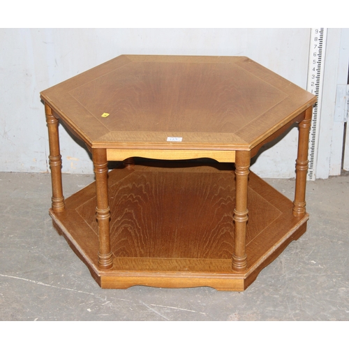 129 - Mid-century polished bi-folding door cupboard on legs with a light oak legate coffee table (2)