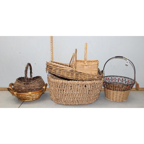 296 - A large qty of assorted wicker baskets etc