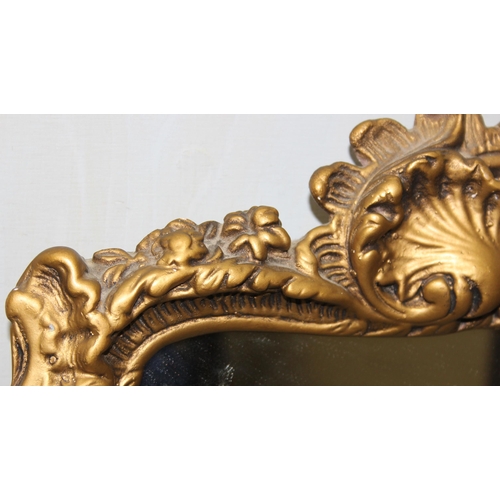 422 - A Rococo style gilt plaster wall mirror