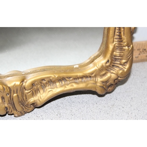 422 - A Rococo style gilt plaster wall mirror