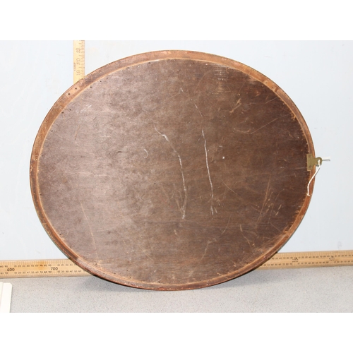 423 - A vintage oval gilt framed wall mirror