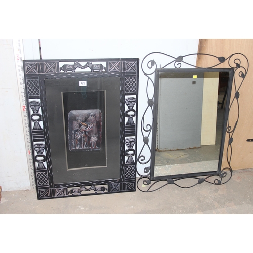 429 - An Ancient Egyptian style relief wall plaque in frame and a wrought iron framed mirror