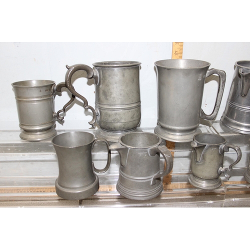 1046 - 13 assorted antique and later pewter tankards and jugs, mainly 19th century, various sizes and shape... 