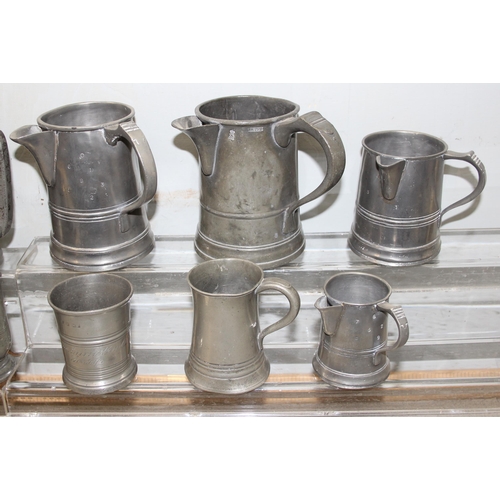 1046 - 13 assorted antique and later pewter tankards and jugs, mainly 19th century, various sizes and shape... 