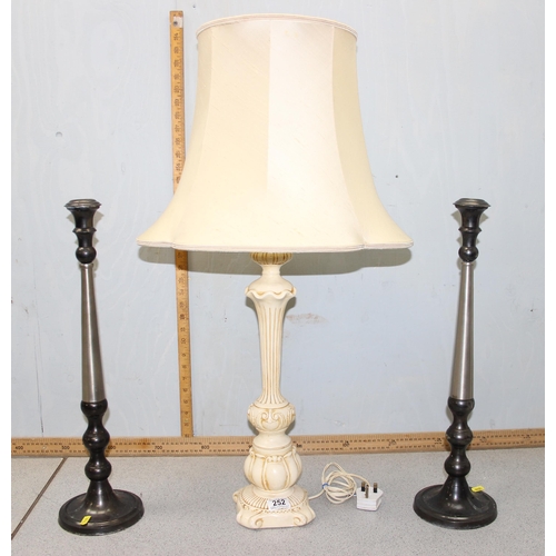 252 - Pottery lamp & shade of classical form & a pair of large metal candlesticks with brushed finish