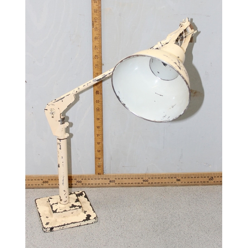 253 - A vintage industrial Anglepoise style lamp with cream painted finish and cast iron base