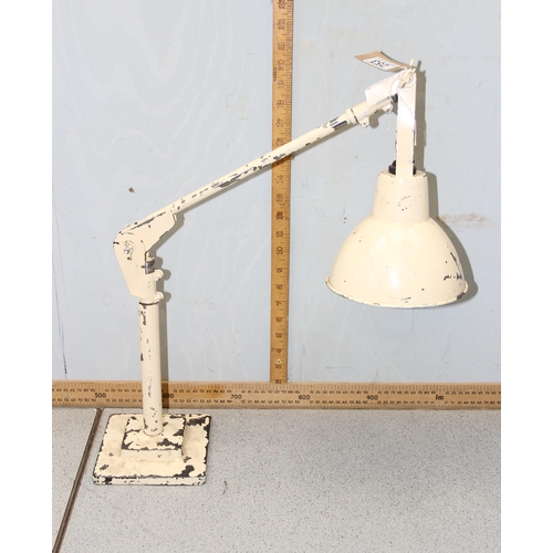 253 - A vintage industrial Anglepoise style lamp with cream painted finish and cast iron base