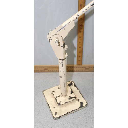 253 - A vintage industrial Anglepoise style lamp with cream painted finish and cast iron base