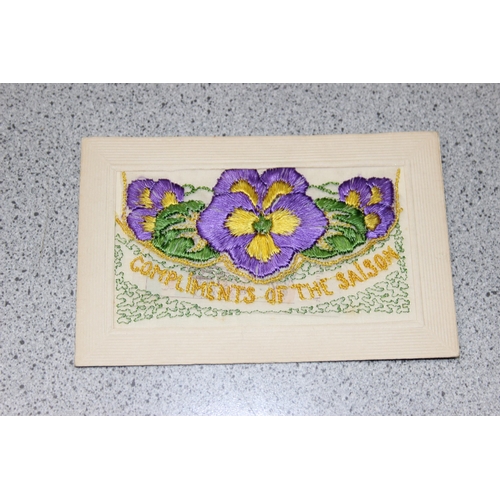 544 - 7 early 20th century silk embroidered postcards, some with original paper envelope and in box