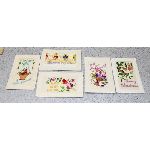 544 - 7 early 20th century silk embroidered postcards, some with original paper envelope and in box