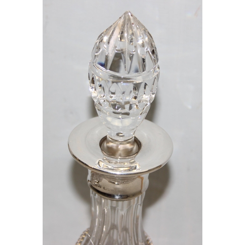 1035 - A silver topped crystal decanter, London 1969 by Roberts & Dore limited, another crystal decanter, b... 