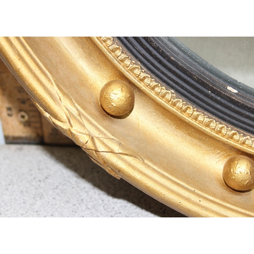 439 - A Georgian style gilt framed convex mirror, approx 48cm in diameter