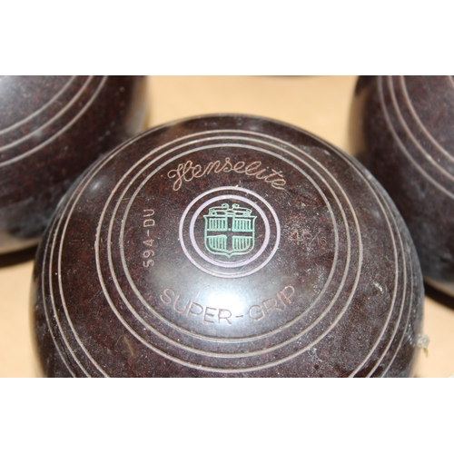 705 - A boxed set of 4 lawn bowls