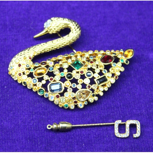 1181 - Swarovski yellow metal jewelled swan brooch & a Swarovski tie pin