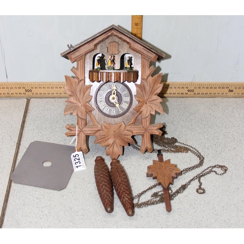 1325 - A vintage West German made cuckoo clock with pendulum and weights