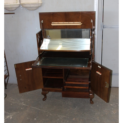 166 - An early 20th century walnut effect drinks or cocktail cabinet made by Herkel Furniture, approx 80cm... 