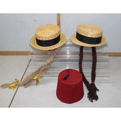 209 - Collection of theatrical dressing up hats to include boaters, police hat & fez.