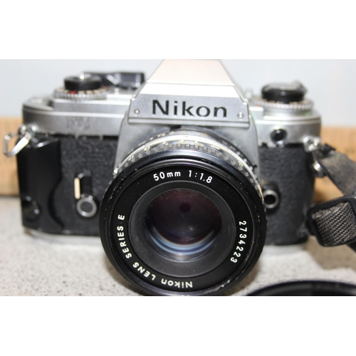 665 - Nikon FG 35mm film camera with Series E 50mm 1:1.8 lens, Kiron 80-200mm lens and other accessories i... 