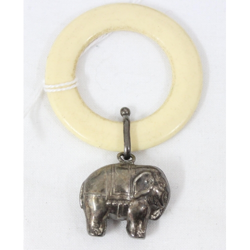 1053 - A silver and ivorine babies' teething ring formed as an elephant, Chester 1957 by W.H. Collins & Co