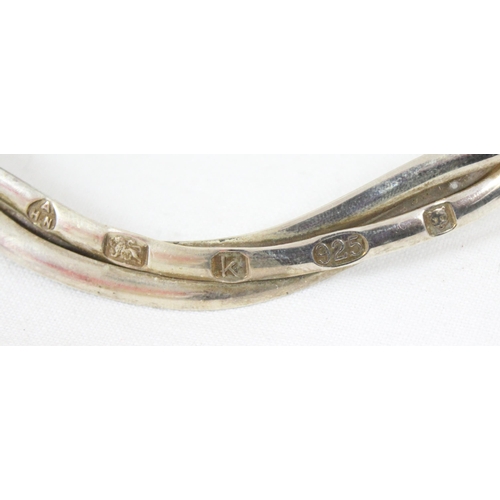 1179 - A contemporary Haviland silver necklet formed from three interwoven bands, marked for London 2009 by... 