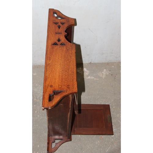 172 - An early 20th century mahogany wall cupboard shelf with fretwork ends, approx 62cm wide