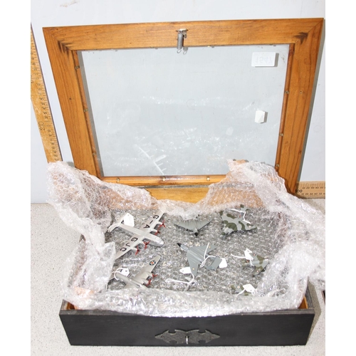 1547 - A glazed table top display case containing 8 Dinky diecast aeroplanes