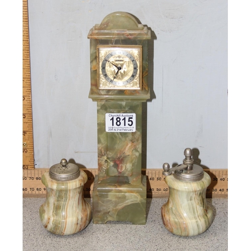 1815 - A vintage Swiza clock in alabaster case, a pair of alabaster salt and pepper pots, a pair of carved ... 