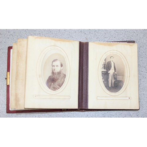 563 - A 19th century leather bound photograph album and photographs,