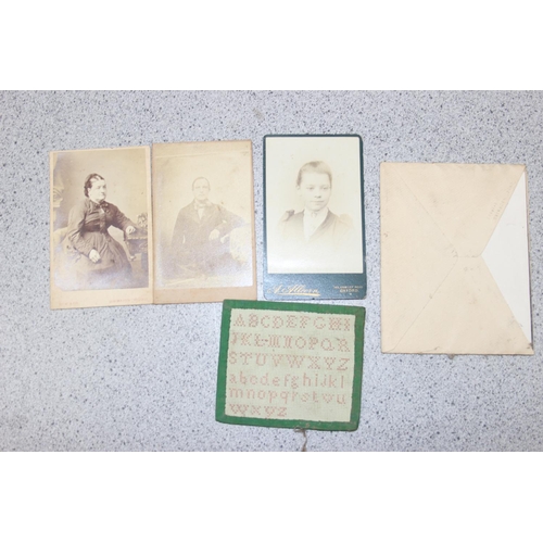 563 - A 19th century leather bound photograph album and photographs,