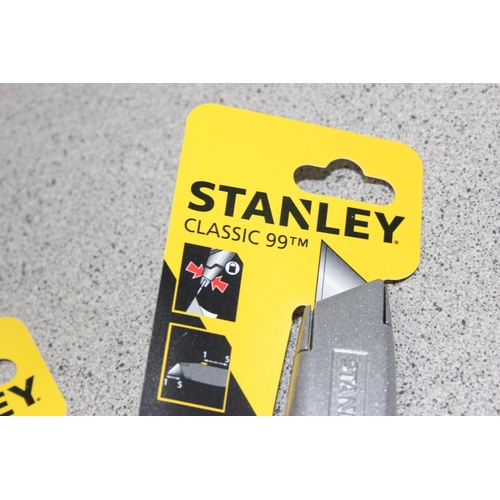 876 - 10 assorted new Stanley knives with packaging