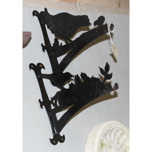 320 - 2 iron hanging basket brackets formed as birds