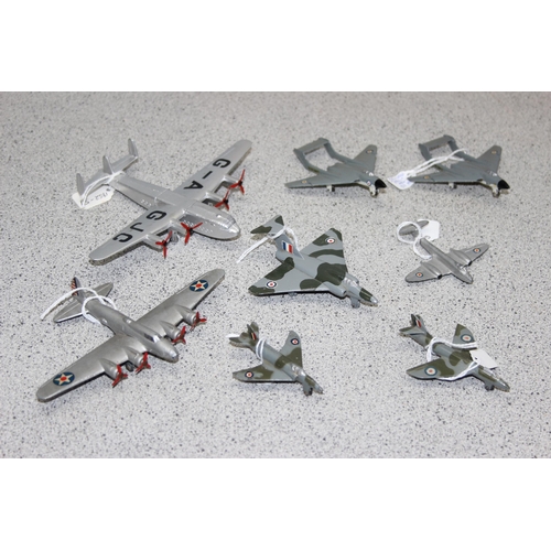 1547 - A glazed table top display case containing 8 Dinky diecast aeroplanes