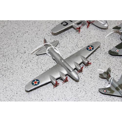 1547 - A glazed table top display case containing 8 Dinky diecast aeroplanes