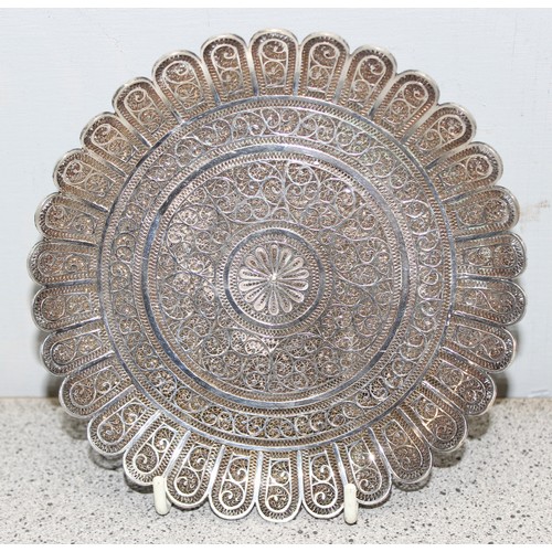 1061 - An intricate silver filigree circular dish, unmarked but XRF tested as approximately 95% pure, appro... 