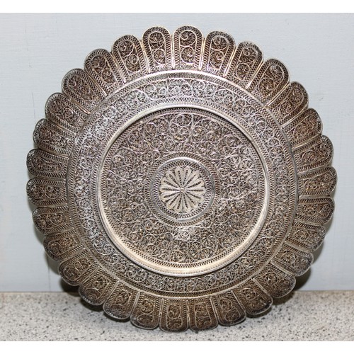 1061 - An intricate silver filigree circular dish, unmarked but XRF tested as approximately 95% pure, appro... 