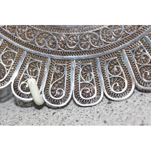 1061 - An intricate silver filigree circular dish, unmarked but XRF tested as approximately 95% pure, appro... 